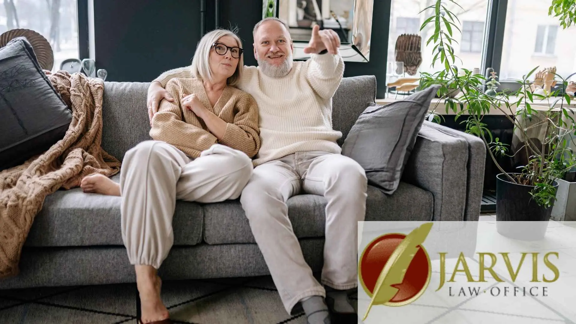 Smiling senior couple relaxing on living room couch