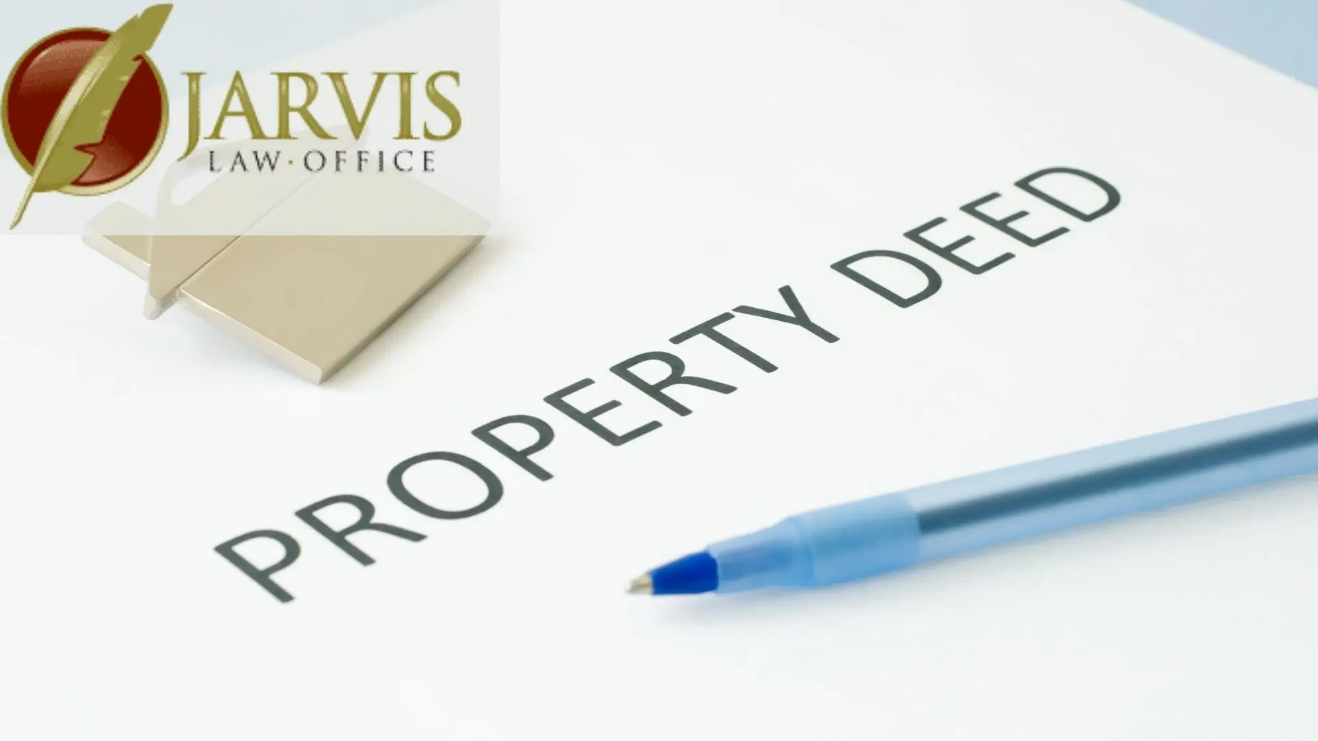Property deed document with pen and law office logo