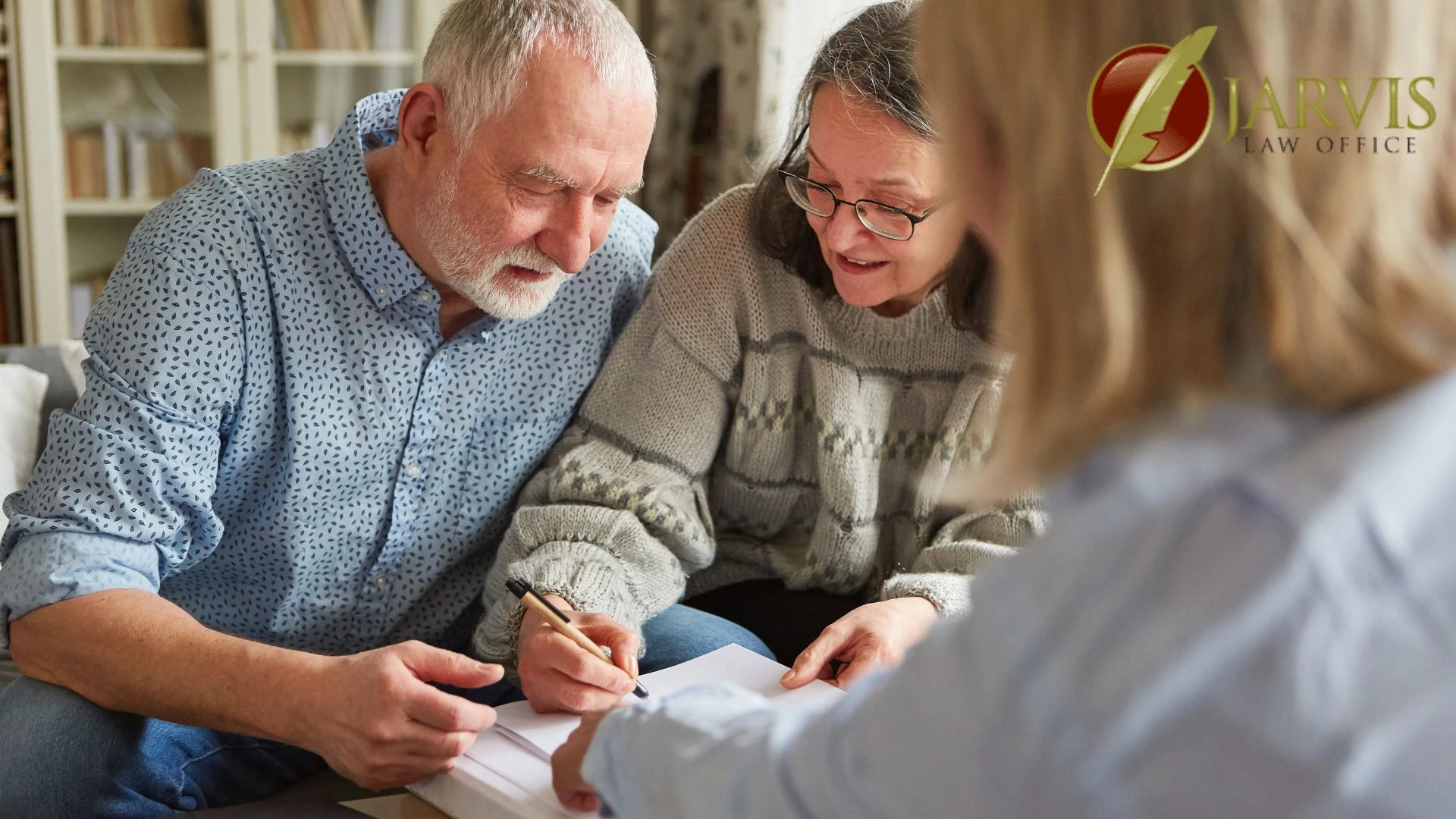 Senior couple signing documents with legal advisor