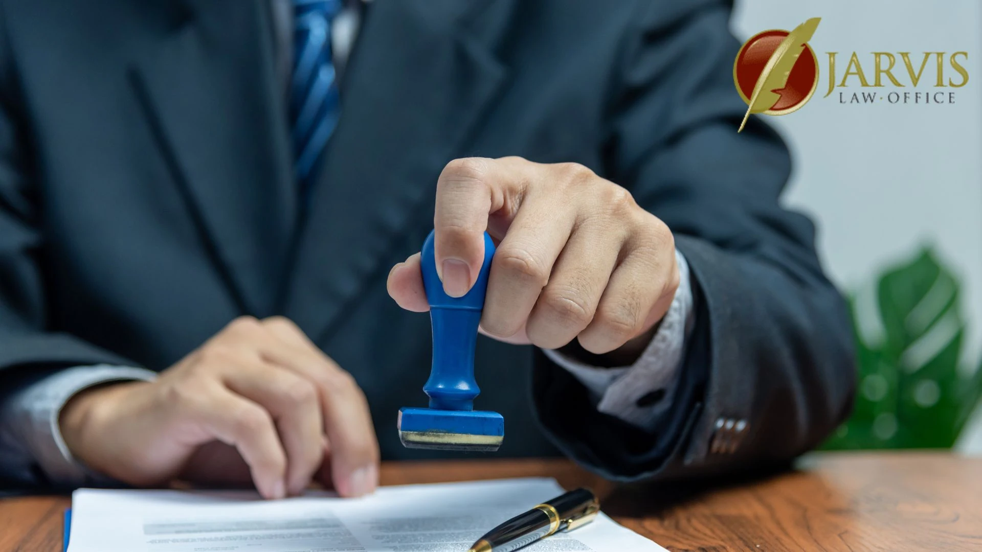 Attorney stamping legal document at desk