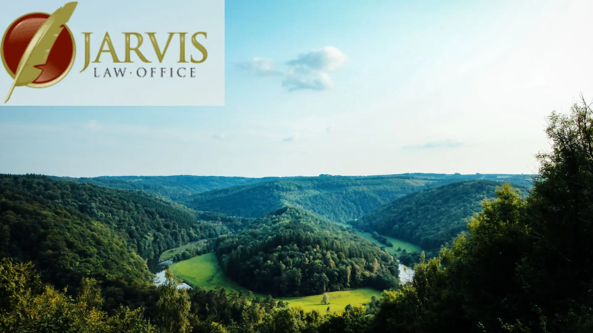 River winding through lush green forest valley
