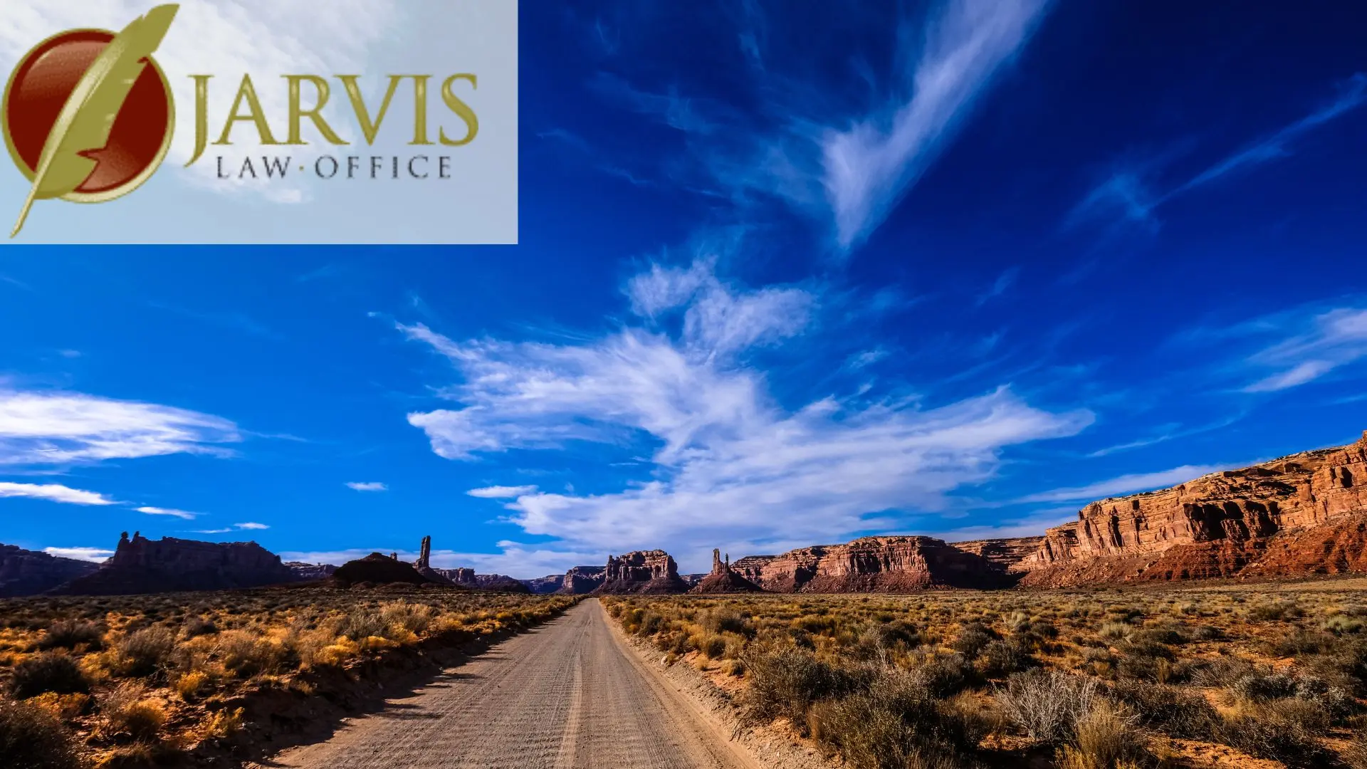 Desert road leading through red rock canyon