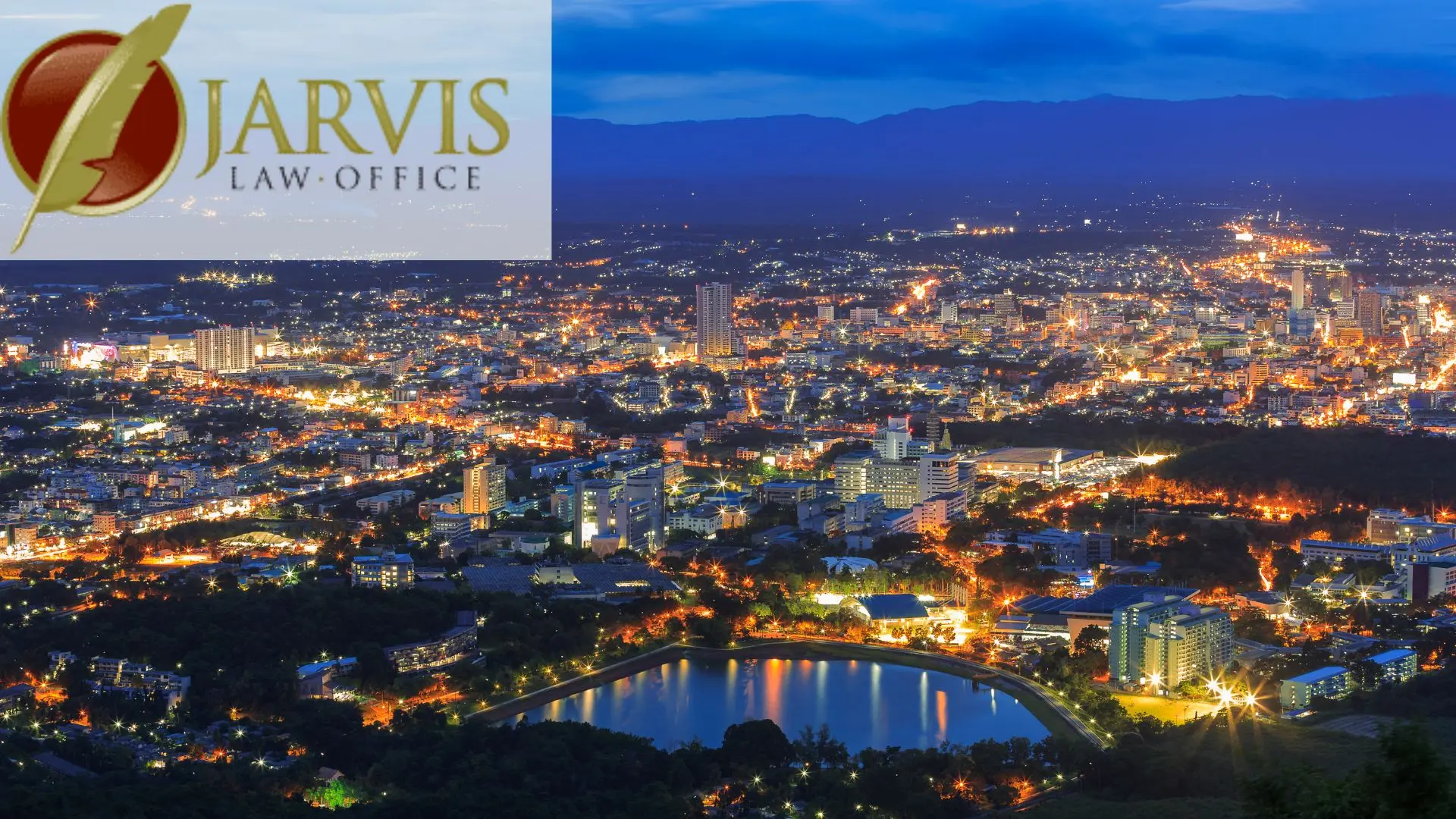 City skyline at night with Jarvis Law Office logo