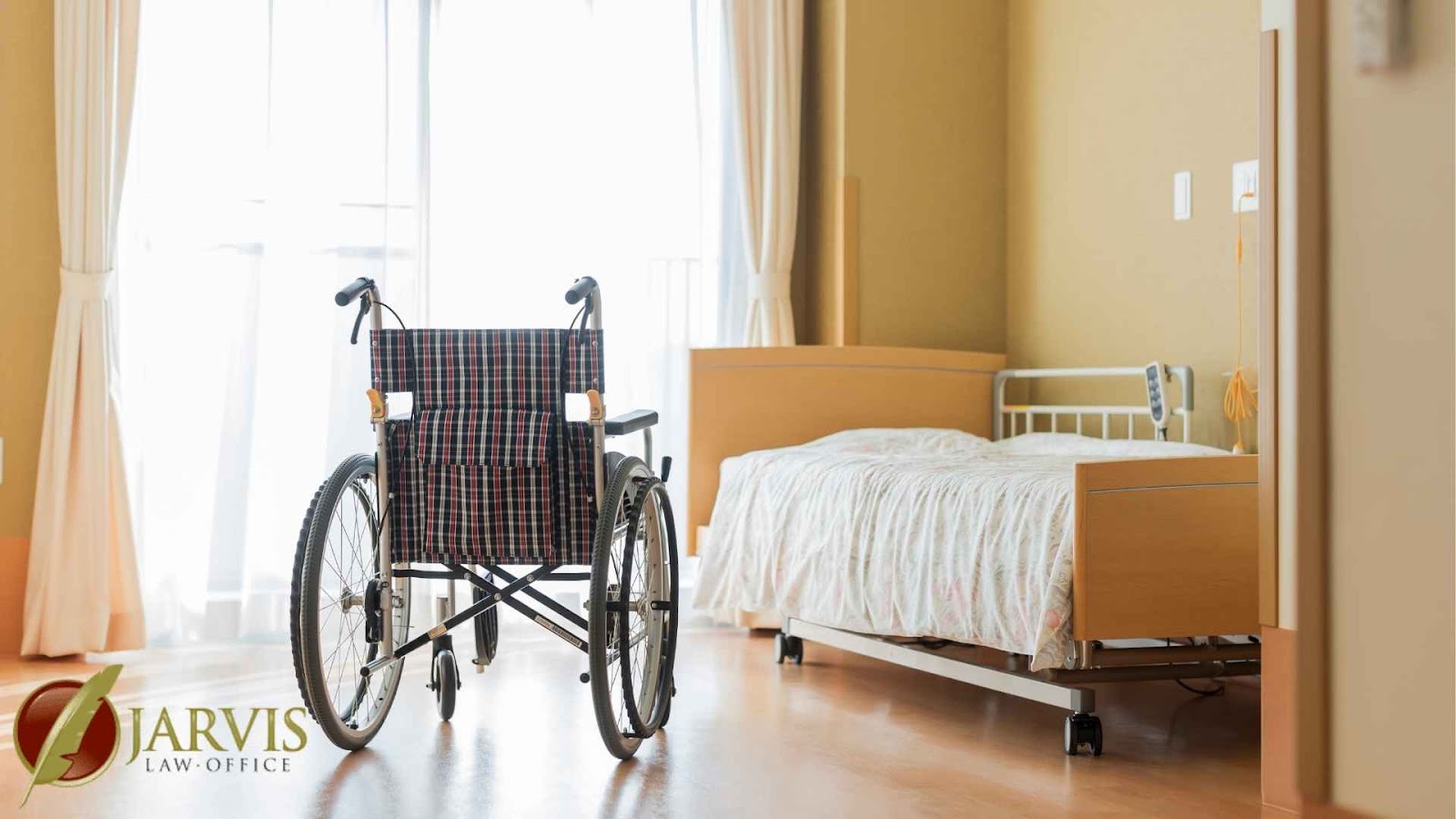 Empty wheelchair next to hospital bed in room.