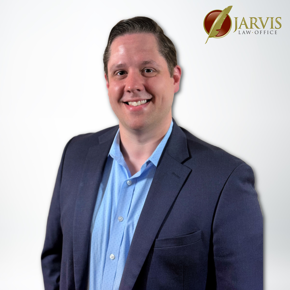 Smiling person in suit with Jarvis Law Office logo.