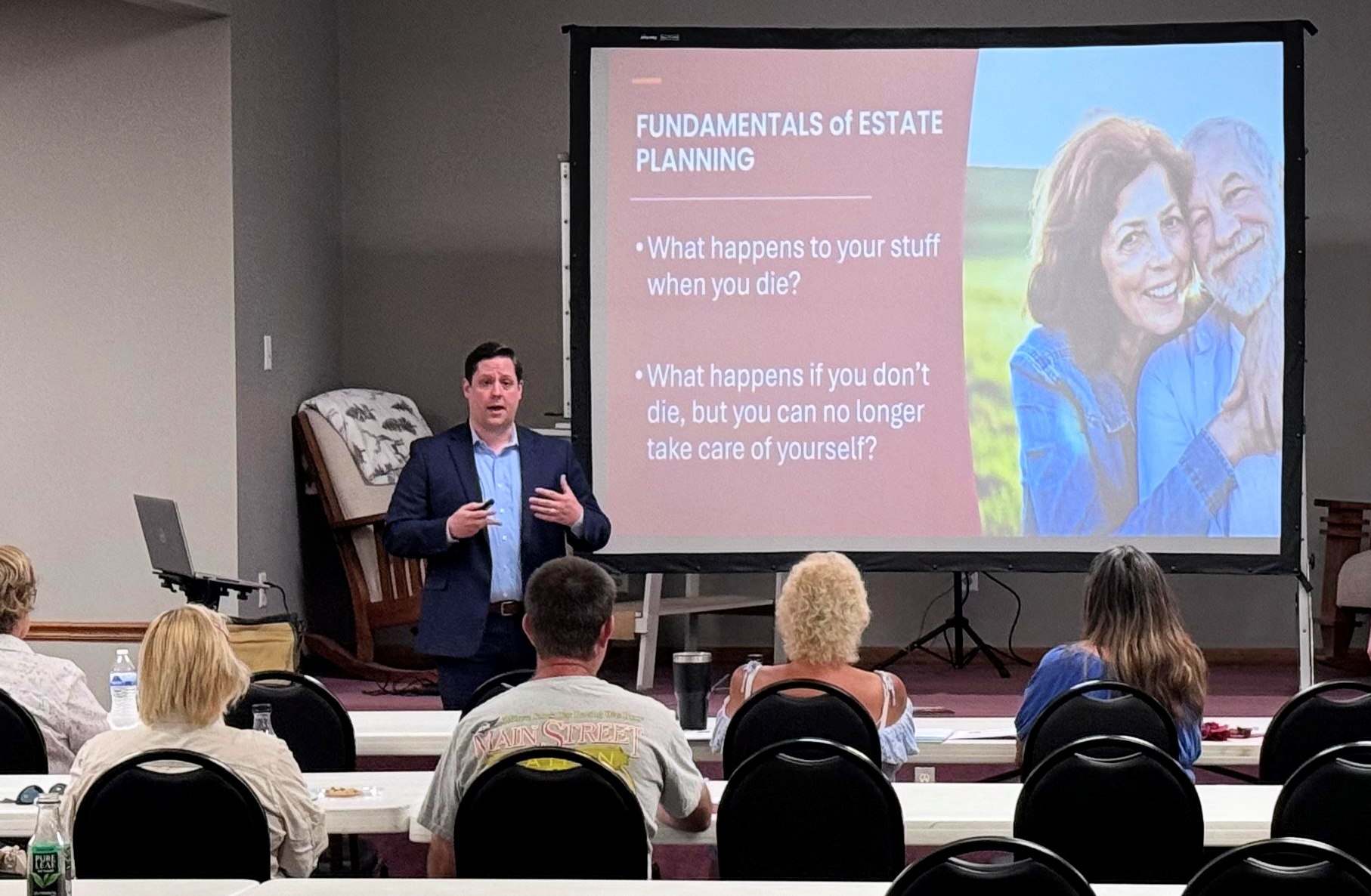 Estate planning seminar presentation with audience.