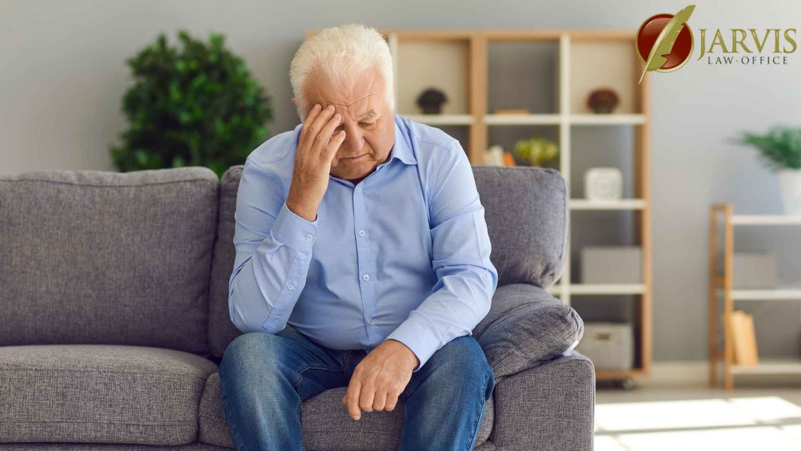 Elderly man looking stressed on sofa, thoughtful expression