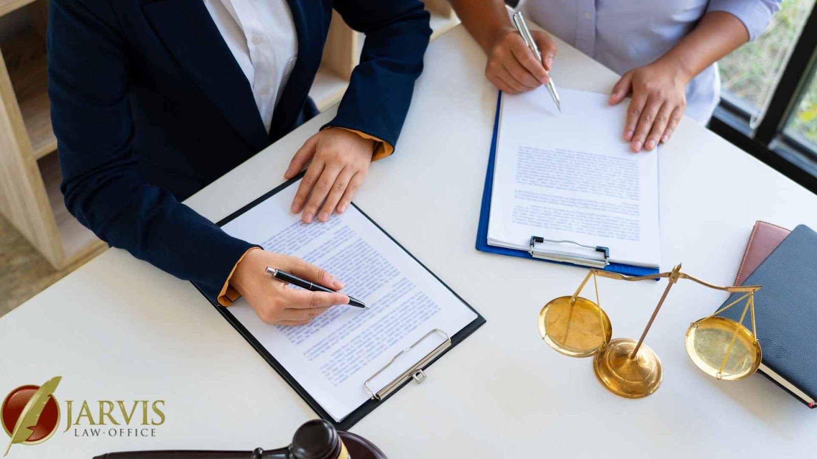 Lawyers reviewing documents in an office setting.