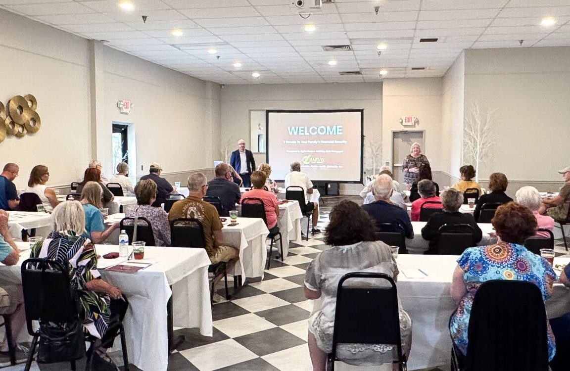 People attending a seminar in a conference room.