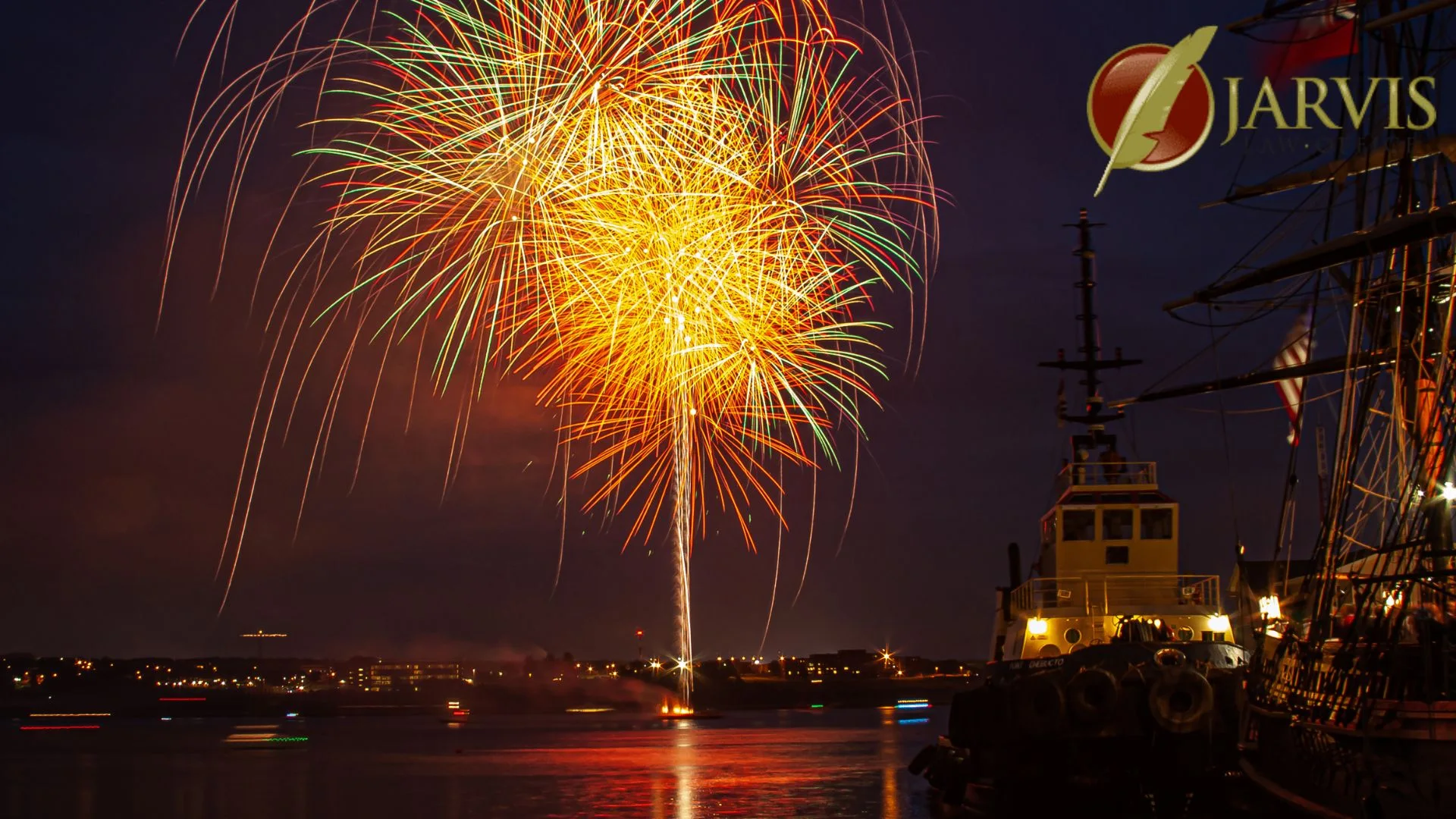 Colorful fireworks over harbor with boats at night