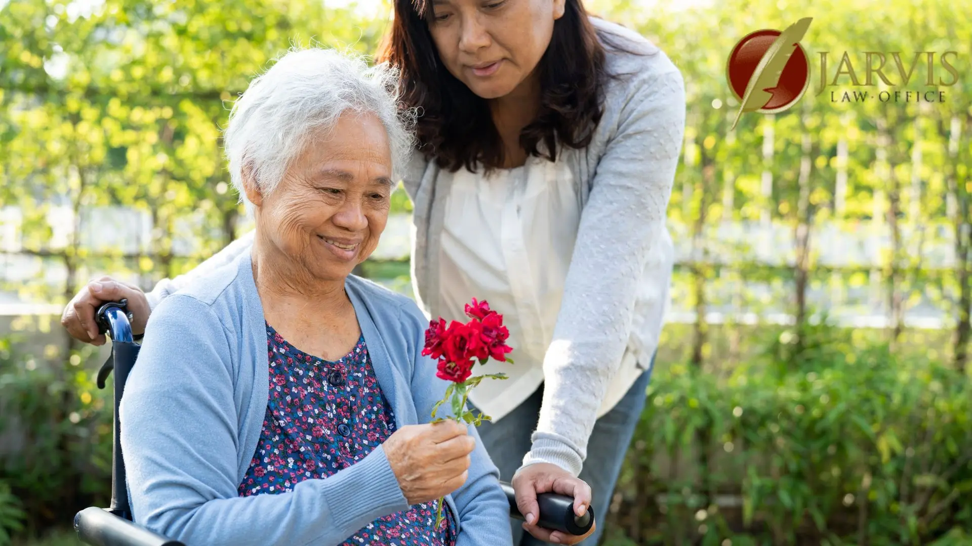 Elderly woman in wheelchair holding red flowers