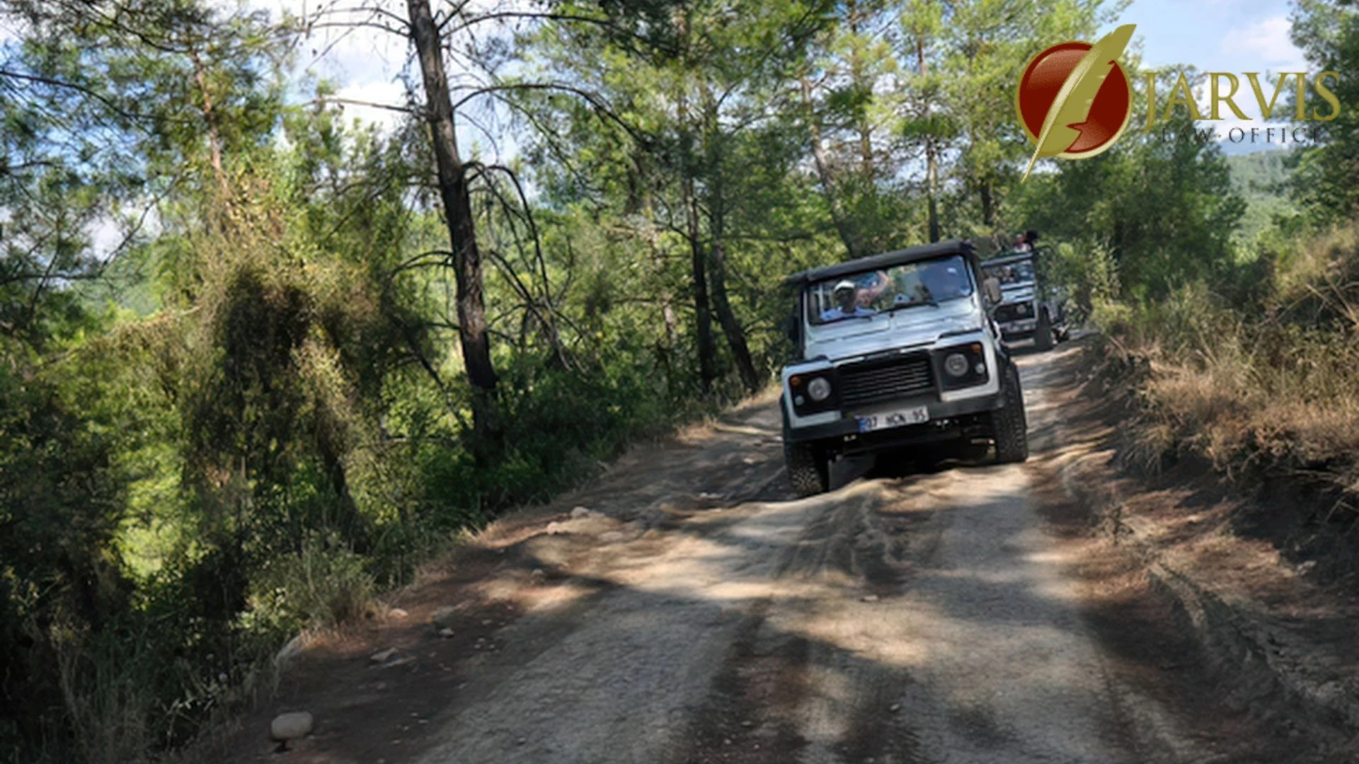 Off-road vehicles driving on forest dirt trail