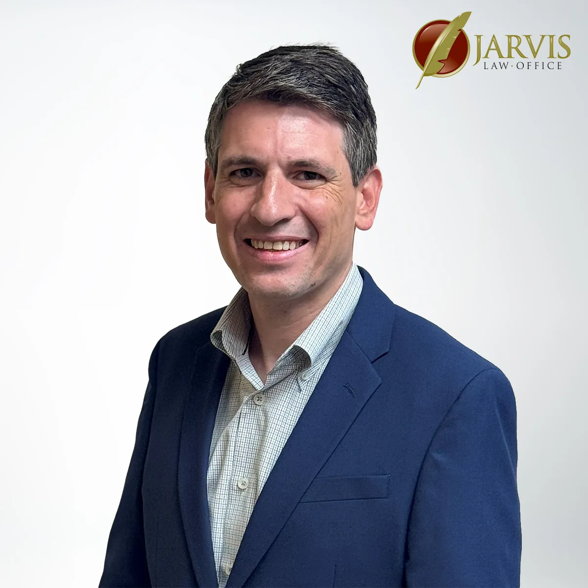 Smiling person in business attire, Jarvis Law Office