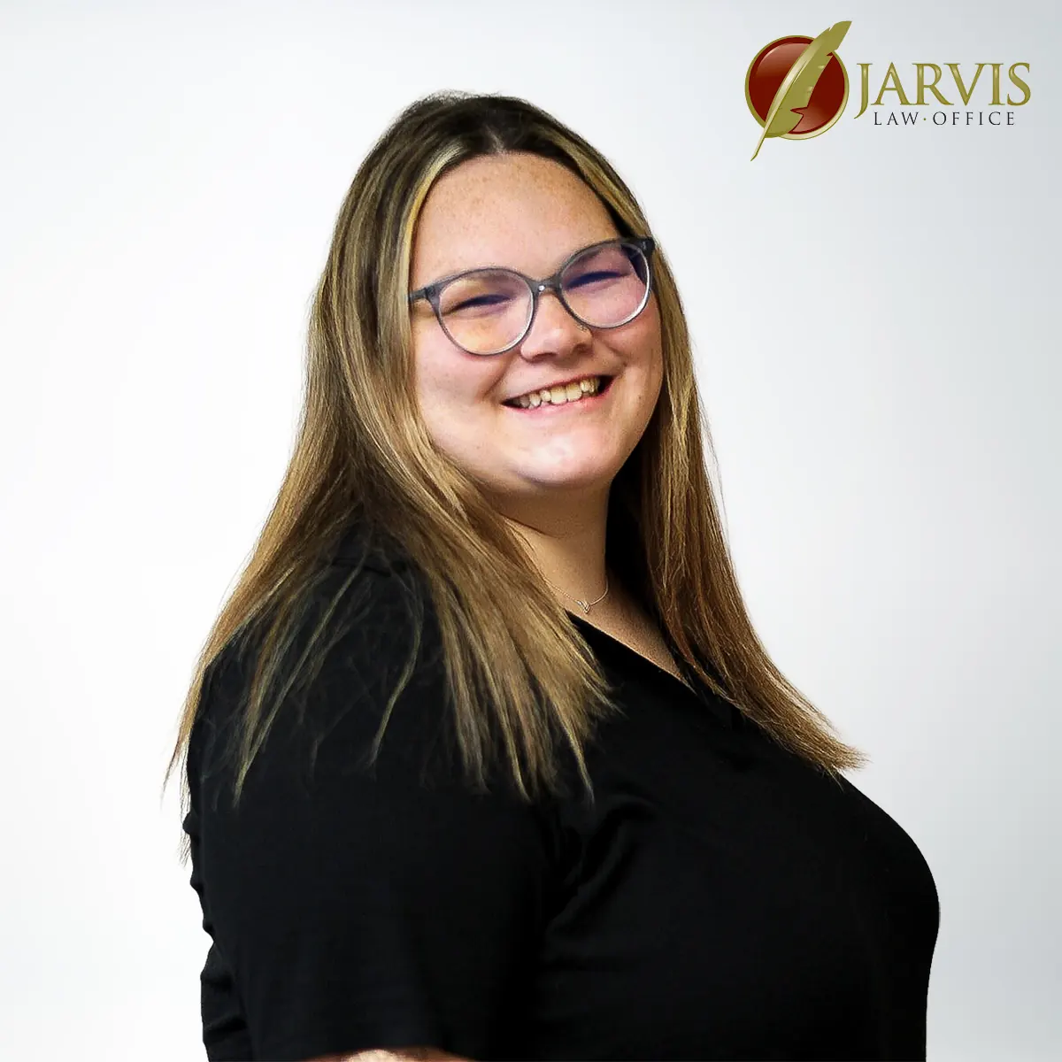Smiling woman with glasses, Jarvis Law Office logo