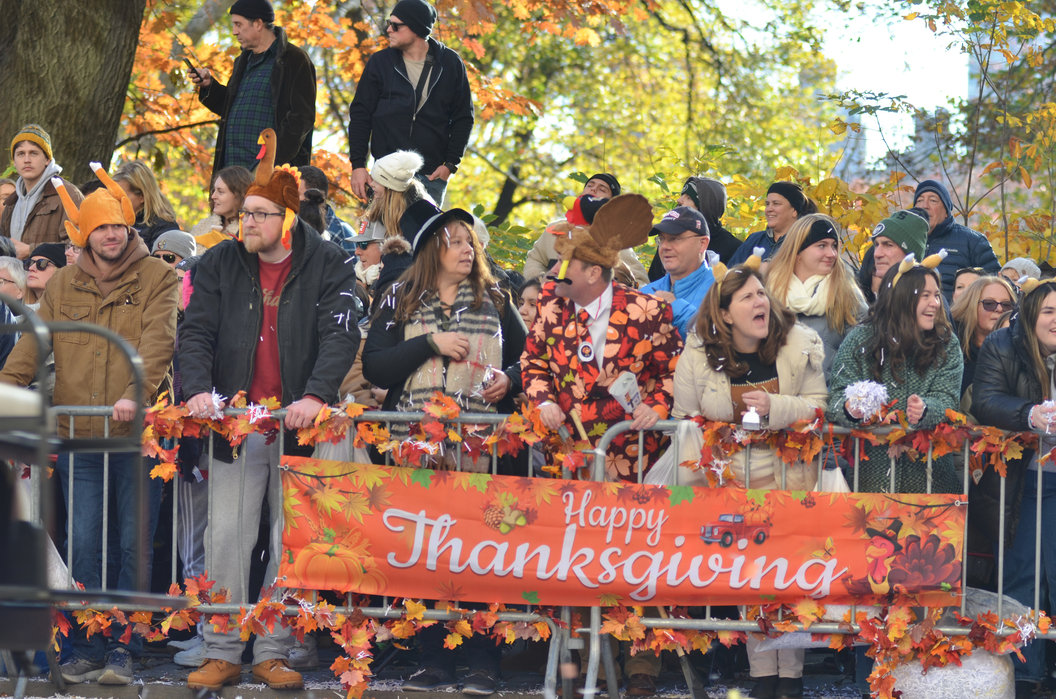 Crowd celebrating Thanksgiving parade outdoors