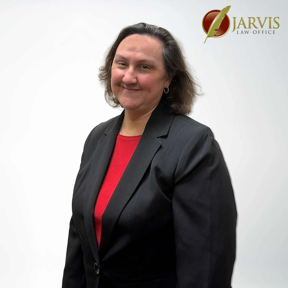 Smiling woman in a black blazer