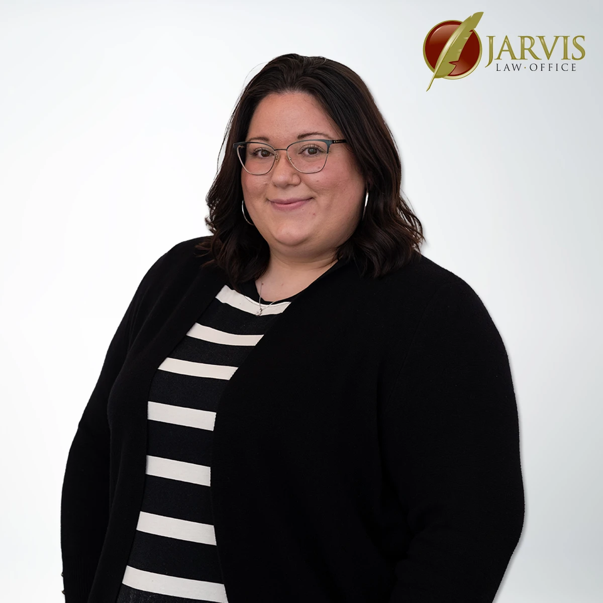 Woman smiling with glasses and striped shirt