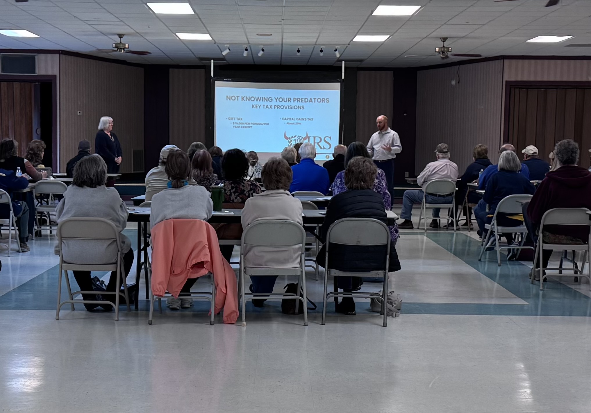 Community tax seminar with presenter and seated audience